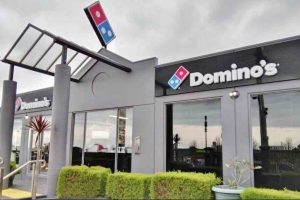 dominos company franchise